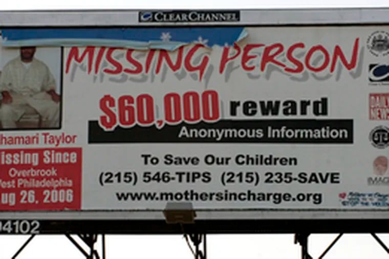 A billboard at 52nd and Walnut streets in West Philly offers a reward for information on Shamari Taylor, son of state Rep. John Myers.