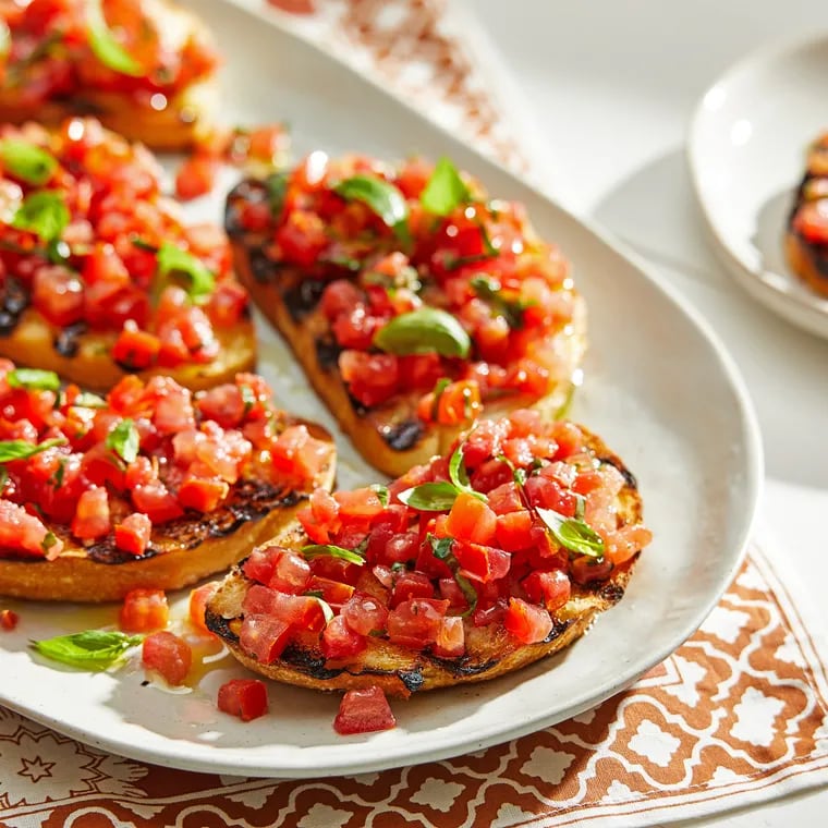 Tomatoes are the go-to topping bruschetta. But the toasted baguette can be topped many other ways.   MUST CREDIT: Photo for The Washington Post by Tom McCorkle