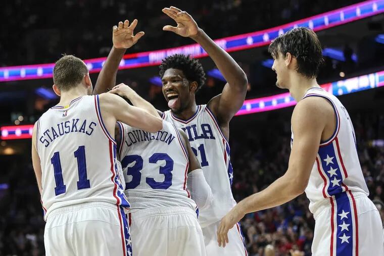 Sixers Robert Covington (33), Nik Stauskas (11), Joel Embiid (21) and Dario Saric celebrate after a go-ahead basket last season against Minnesota. There likely will be more celebrations this coming season.