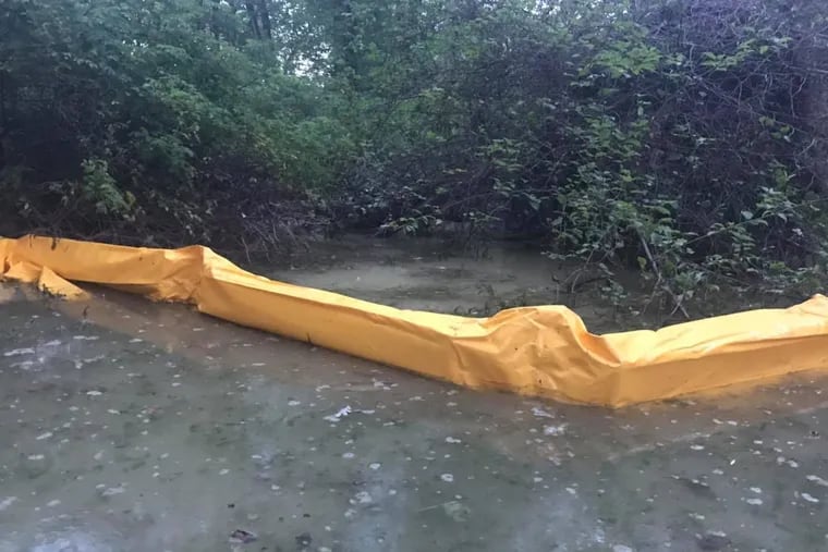 West Whiteland Residents for Pipeline Safety posted this picture of a boom erected in White Marsh Creek Lake after what environmental groups say was 1,000 gallons of fluid used in horizontal drilling.