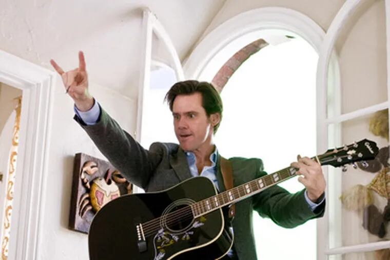 Jim Carrey makes a positive impression as a bank loan officer who suddenly can&#0039;t say no in &quot;Yes Man.&quot;