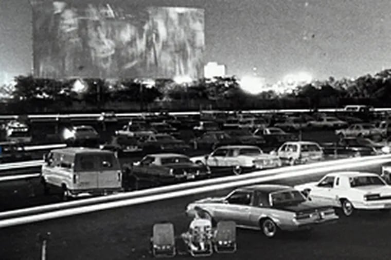 Patrons of the Tacony-Palmyra Drive-In Theater settle in their cars for a night's entertainment in August 1985. Little did they know there were scores of unexploded artillery shells under the parking lot. (David Jackson/Inquirer file)