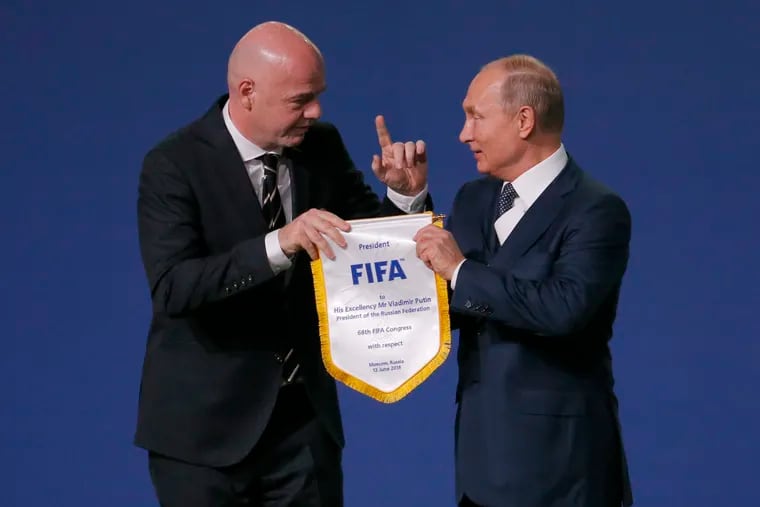 FIFA president Gianni Infantino (left) with Russian president Vladimir Putin in June 2018, when Russia hosted the last men's World Cup.