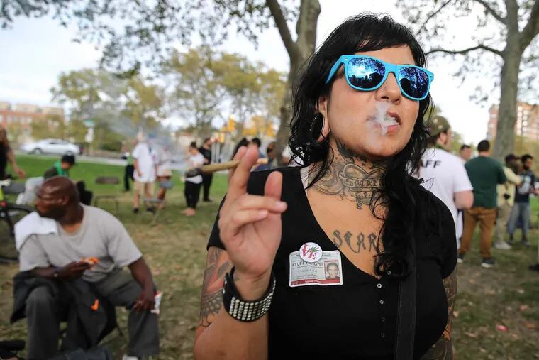 Jen Zavala helps to mark the two-year anniversary of the decriminalization of marijuana in Philadelphia at a "Pop-Up Weed Garden" near the Philadelphia Museum of Art Thursday, October 20, 2016. A recent Franklin & Marshall College poll showed 59 percent of those surveyed support legalizing marijuana for recreational use, a sharp reversal from when the poll first asked the question in 2006, when just 22 percent approved.