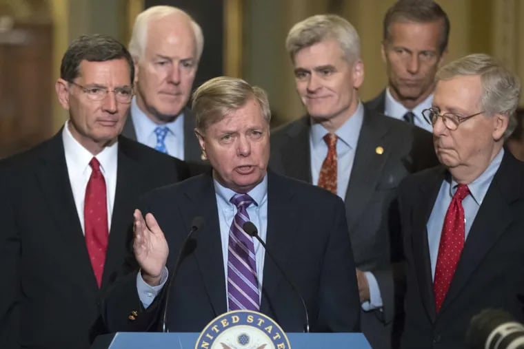 Sen. Lindsey Graham, R-S.C., joined by, from left, Sen. John Barrasso, R-Wyo., Majority Whip John Cornyn, R-Texas, Sen. Bill Cassidy, R-La., Sen. John Thune, R-S.D., and Senate Majority Leader Mitch McConnell, R-Ky., speaks to reporters as he pushes a last-ditch effort to uproot former President Barack Obama’s health care law, at the Capitol in Washington, Tuesday, Sept. 19, 2017.