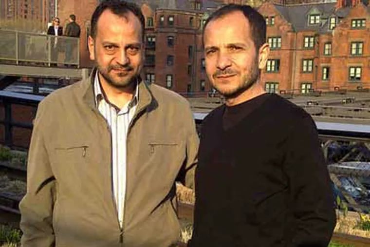 Sakher Hallak (left) with his brother Hazem in Manhattan this year. Sakher, unafraid of violence at home, had stayed and traveled with Hazem, who lives in Merion Park.