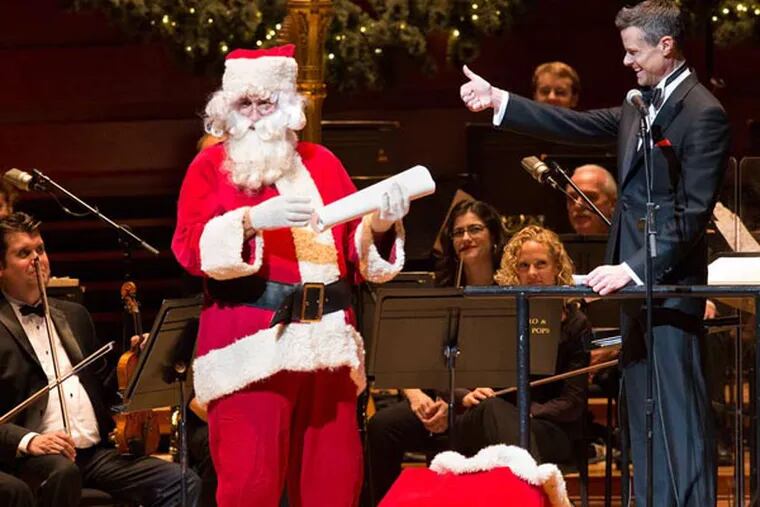 DSSPOPS10 Guest conductor David Charles Abell with the Philly Pops. And Santa (left).
Photo by Mark Garvin.