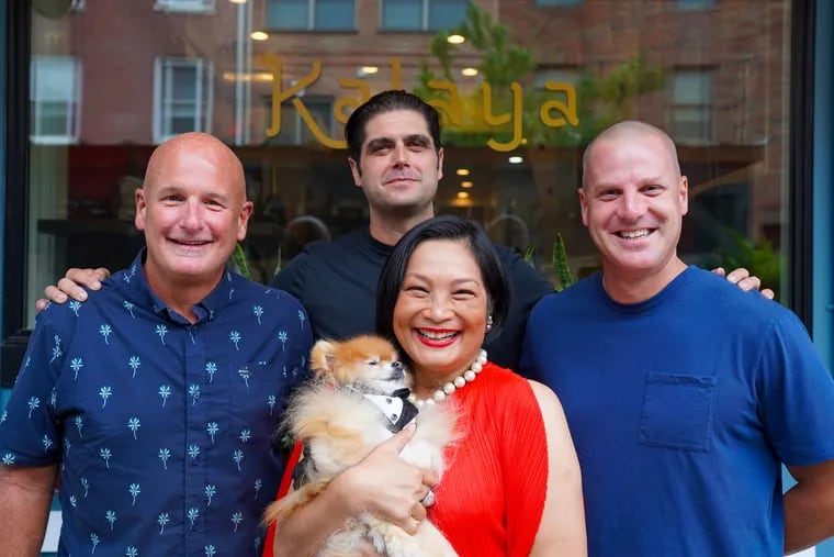 Kalaya chef-owner Chutatip “Nok” Suntaranon and her Pomeranian, Tong, with business partners (from left) Al Lucas, Nick Kennedy, and Greg Root.
