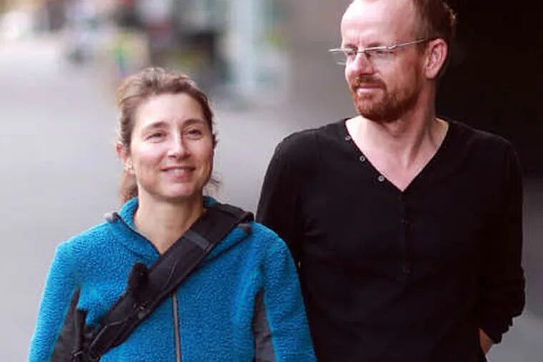 Esther Polak and Ivar van Bekkum on Market Street. (DAVID SWANSON / Staff Photographer)