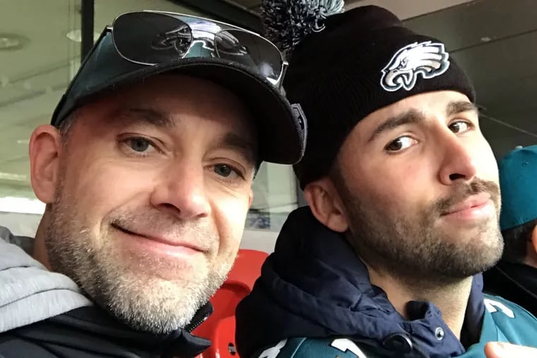 Jeff Trinder (left) and his partner, Paulo Santana, at Wembley Stadum in London in October 2018. They flew to London to see the Eagles play but when they arrived, Trinder couldn't get a hold of the tickets he'd bought from reseller Vivid Seats.