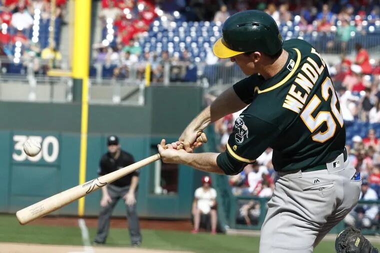 Oakland’s Joey Wendle connects for a grand slam in the sixth inning.