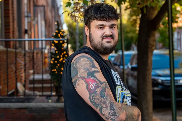 Dillon Schmanek is photographed near his home in South Philadelphia. Dillon is a diehard Sixers fan who got a full Ben Simmons tattoo back when "the process" was looking good.