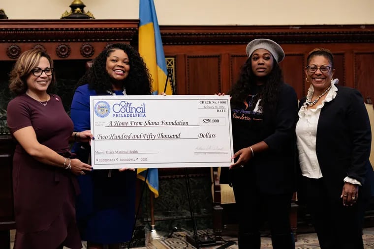 (L-R) State Representative Gina H. Curry, Councilmember Katherine Gilmore Richardson, Cleopatra Robinson, Founder of a Home for Shana Foundation, and Marianne A. Fray, President & CEO of Maternity Care Coalition, pose for a photo after Robinson received a check from Councilmember Katherine Gilmore Richardson for $250,000 to in Philadelphia, Pennsylvania, February 28, 2024.