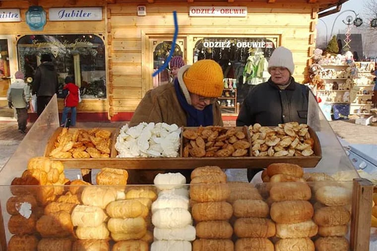 This is a Jan. 14, 2006 file photo of a street vendor selling regional smoked cheese 'oscypek ' in Zakopane, Poland. Little Miss Muffet could have been separating her curds and whey from the sixth millennium B.C., according to a new study that finds the earliest solid evidence of cheese-making. Scientists performed a chemical analysis on fragments from 34 pottery sieves discovered in Poland to determine what they were used for. Until now, experts weren't sure whether such sieves were used to make cheese, beer or honey. (AP Photo/Czarek Sokolowski, File)