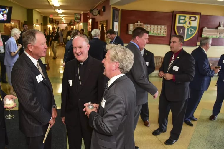 Celebrating the 5th anniversary of Faith in the Future Foundation’s management of Archdiocese high schools. are (from left) Ed Hanway,  chairman of the foundation board; Rev. Michael J. Fitzgerald, auxilary Bishop of Education;  and Samuel Casey Carter CEO of the foundation, at a reception and program at Monsignor Bonner &amp;  Archbishop Prendergast High School on Sept. 18.  CLEM MURRAY / Staff Photographer