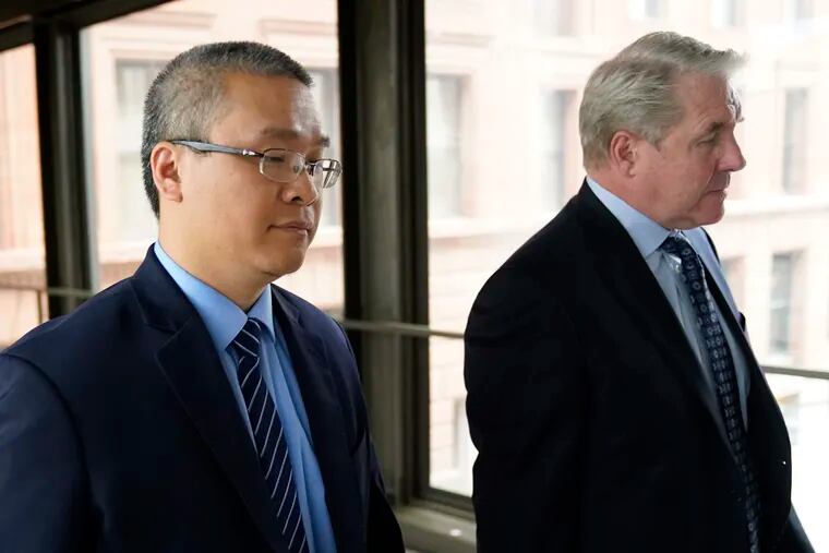 Former Minneapolis police officer Tou Thao, left, and his attorney, Robert Paule, arrive for sentencing for violating George Floyd's civil rights outside the Federal Courthouse in 2022 in St. Paul, Minn