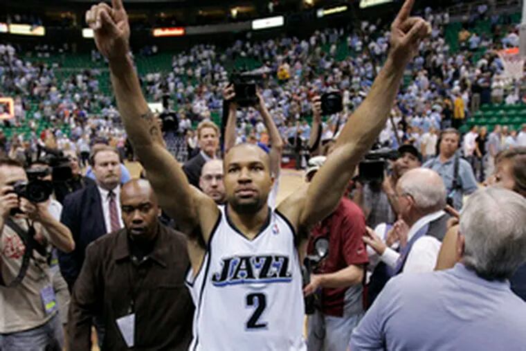 Derek Fisher walks off the court a happy man after Utah&#0039;s 100-87 triumph over Golden State. Tuesday, the Jazz reached the conference finals for the first time since 1998.