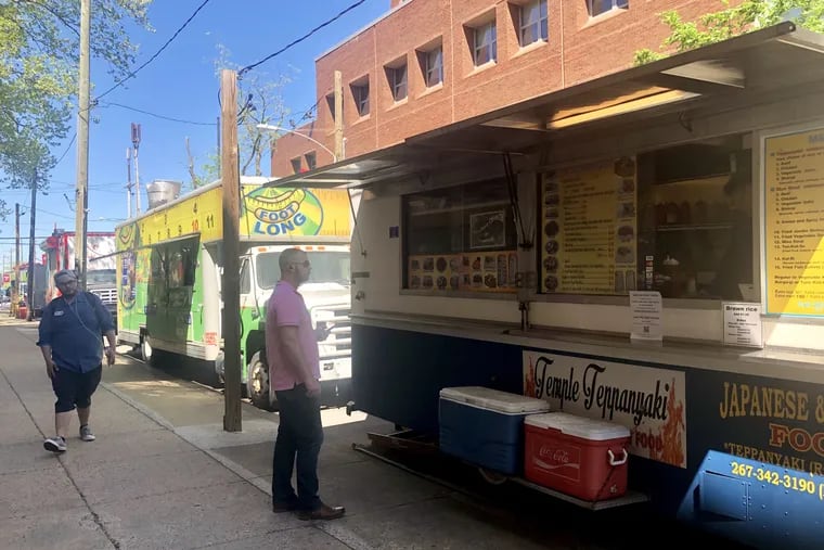 Food trucks along 12th Street near Norris Street on Temple University's campus.