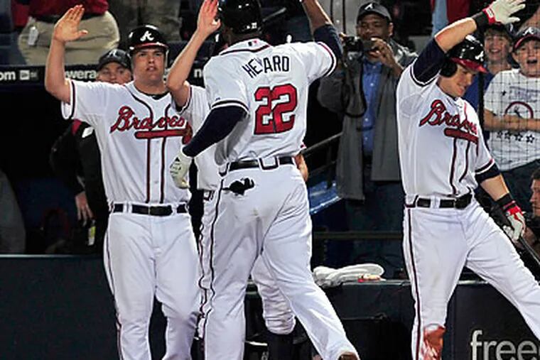 Braves phenom Jason Heyward celebrates after his game-tying home run in the ninth inning. (Gregory Smith/AP)