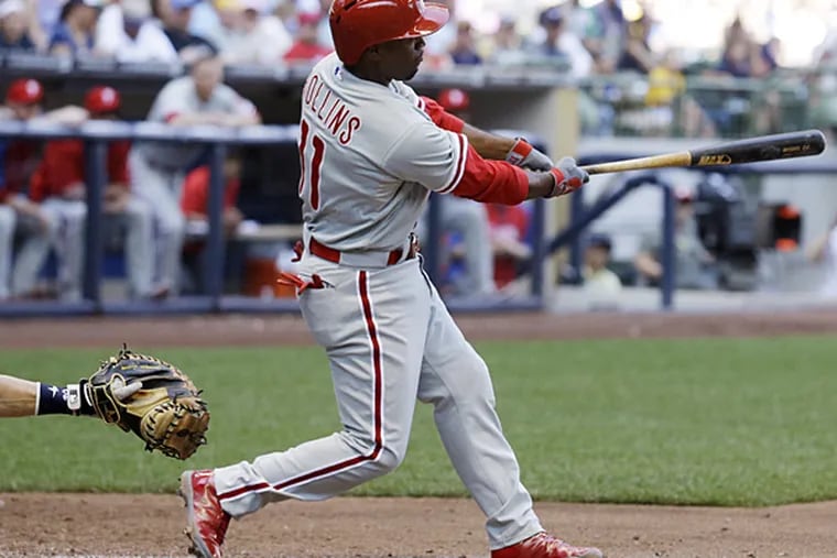 Jimmy Rollins hits a two-run single during the eighth inning against the Brewers on Thursday, July 10, 2014, in Milwaukee. (Morry Gash/AP)