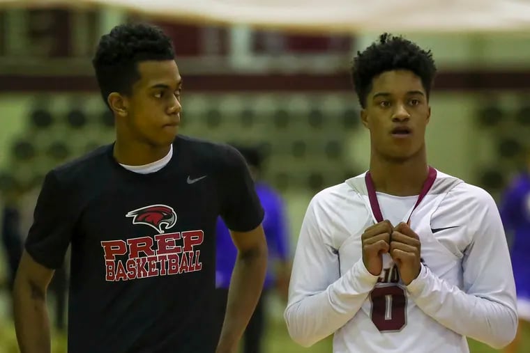 St. Joe’s Prep guard's Jaron McKie (left) and teammate Olin Chamberlain Jr., before St. Joe’s Prep played Conwell-Egan on Sunday, January 9, 2022.  McKie is the son of Temple head coach and former NBA player Aaron McKie and Chamberlain Jr., is the grand-nephew of Wilt Chamberlain.