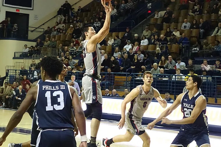 Penn's Michael Wang hits a jumper in the first half against Yale.