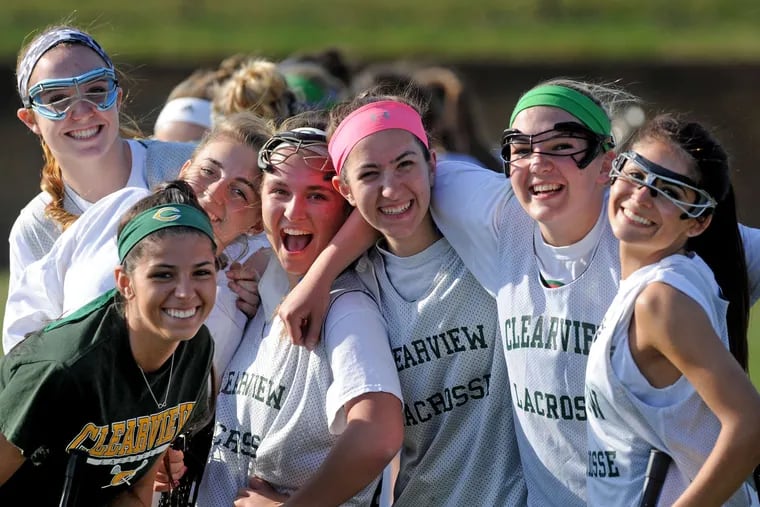 Clearview's Hannah Quast (second from right), recovering from February surgery on her right knee, relies on her teammates for support. TOM GRALISH / Staff Photographer