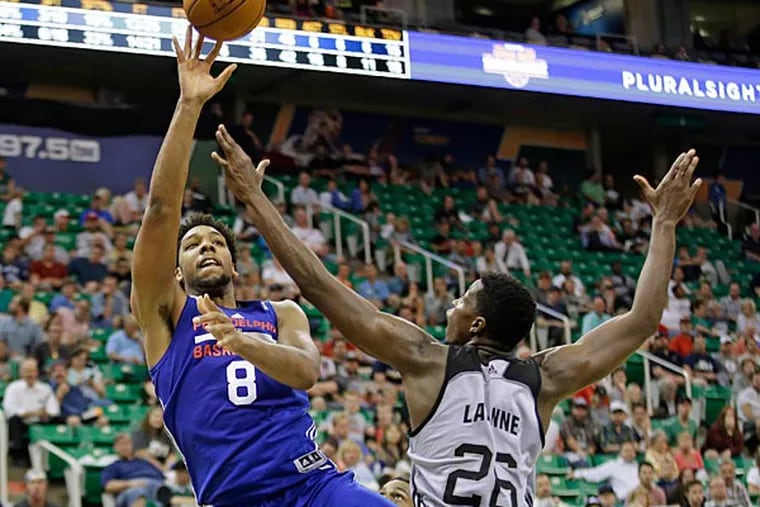 San Antonio Spurs Cady Lalanne (26)  defends against Philadelphia 76ers Jahlil Okafor (8) as he shoots during the second half of an NBA
summer league basketball game Monday, July 6, 2015, in Salt Lake City. (Rick Bowmer/AP)