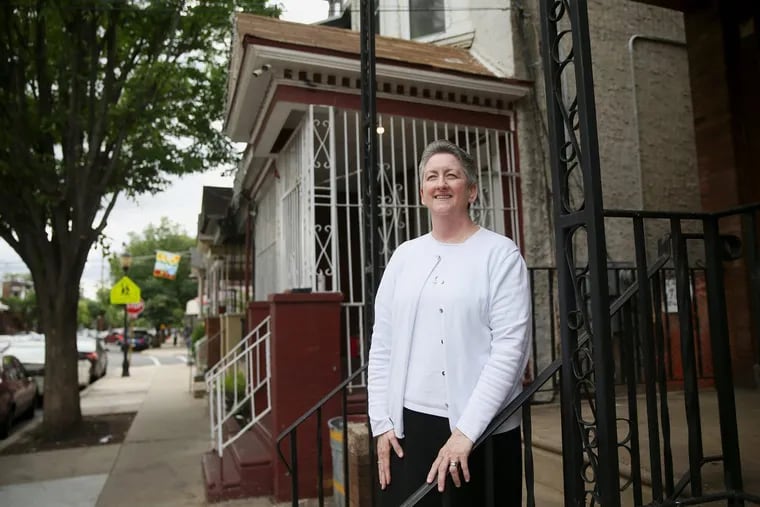 Sister Helen Cole stands for a portrait at her North Camden organization, Guadalupe Family Services, on Wednesday, May 30, 2018. Cole, who was once a teacher and is now a social worker, founded the organization more than 20 years ago. Back then, she said, the neighborhood was considered much rougher, with open-air drug dealing on street corners. TIM TAI / Staff Photographer