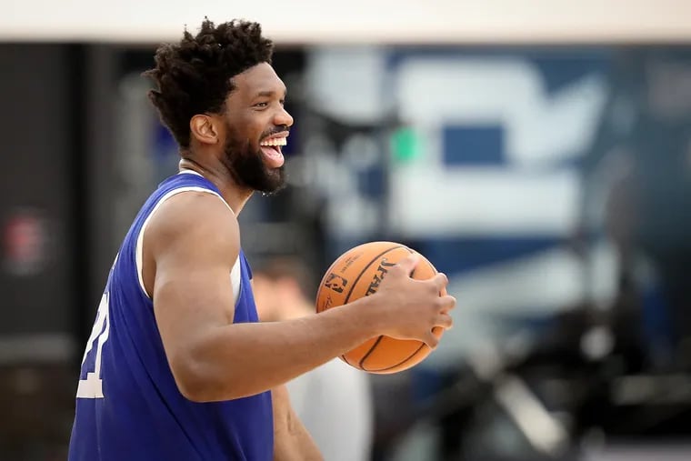 Joel Embiid laughing during Sixers practice Wednesday. He wants to go back to having fun on the court.