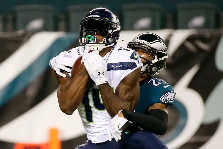 Seahawks WR DK Metcalf makes a catch in front of Eagles cornerback Darius Slay during the second quarter. Metcalf finished with 10 catches for a career-high 177 yards.