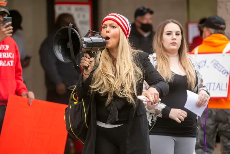 Stephanie Hazelton, who also identifies herself as Ayla Wolf, spoke to the crowd gathered outside Atilis Gym in May 2020. Video now shows Hazelton amid a crowd of rioters attempting to breach the U.S. Capitol on Jan. 6.