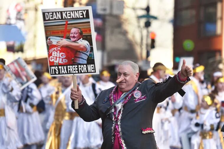 Mike Inenar of the Finnegans Brigade pokes fun at Mayor Kenney’s soda tax in this year’s Mummers Parade.