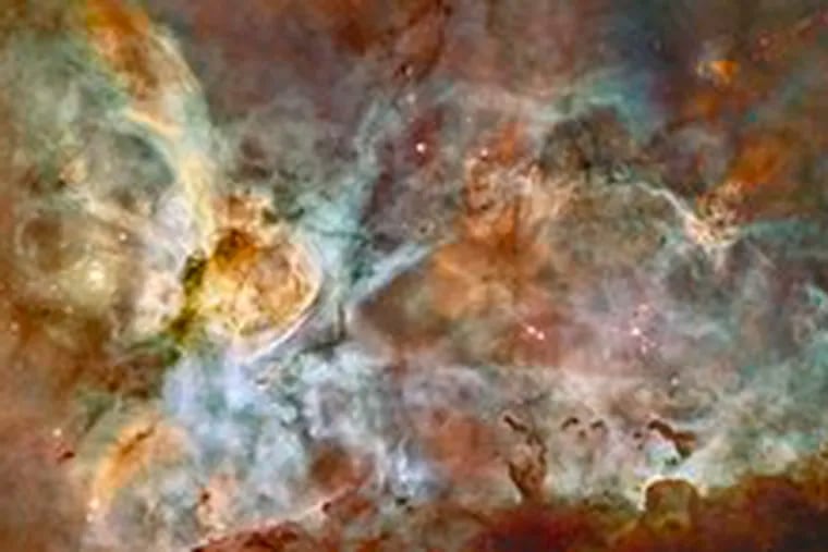 A 50-light-year-wide view of the Carina Nebula from Hubble Space Telescope cameras shows the process of star birth at a new level of detail. The bizarre landscape of the nebula is sculpted by the action of outflowing winds and scorching ultraviolet radiation from the monster stars that inhabit this inferno. These stars are shredding the surrounding material that is the last vestige of the giant cloud from which the stars were born. This immense nebula contains a dozen or more brilliant stars that are estimated to be at least 50 to 100 times the mass of our sun. The fireworks in the region started three million years ago.