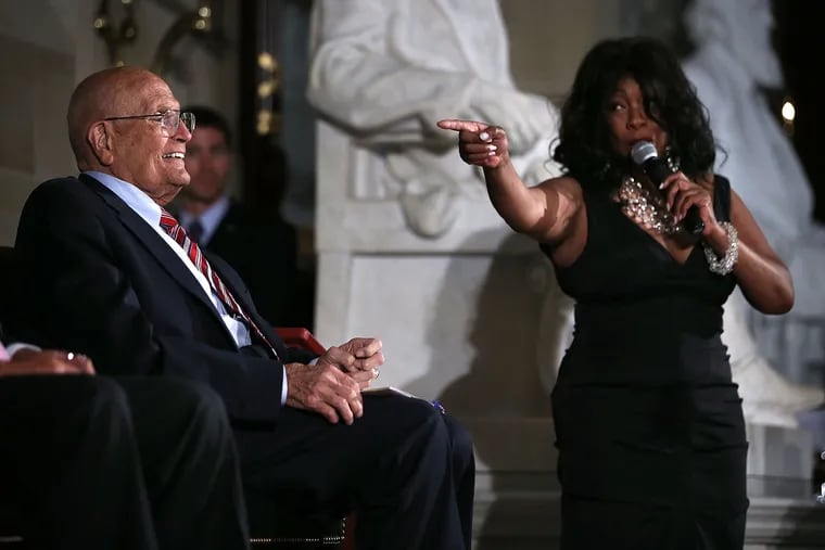 Singer Mary Wilson (R) performs for U.S. Rep. John Dingell (D., Mich.) during a celebration recognizing Dingell as the longest-serving member in the history of the United States Congress June 13, 2013, at the Statuary Hall of the U.S. Capitol in Washington.  (Alex Wong / Getty Images / TNS)