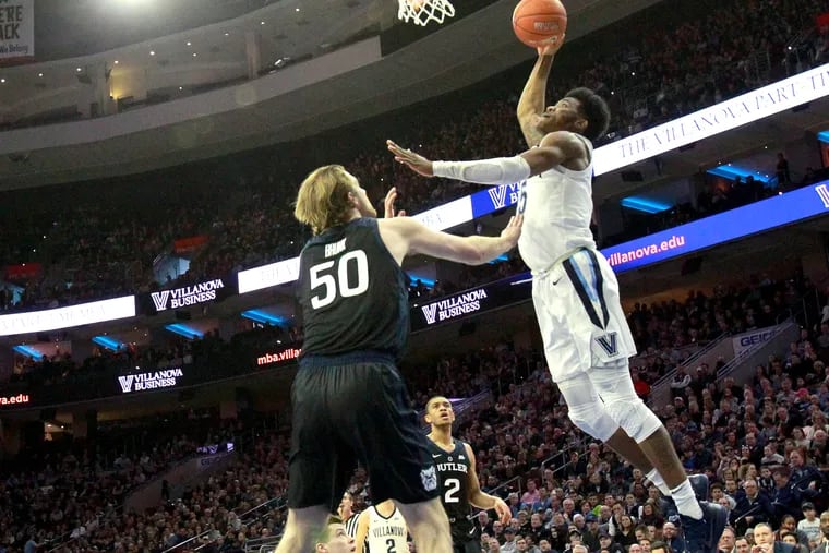 Saddiq Bey of Villanova dunks over Joey Brunk of Butler during their game on March 2.