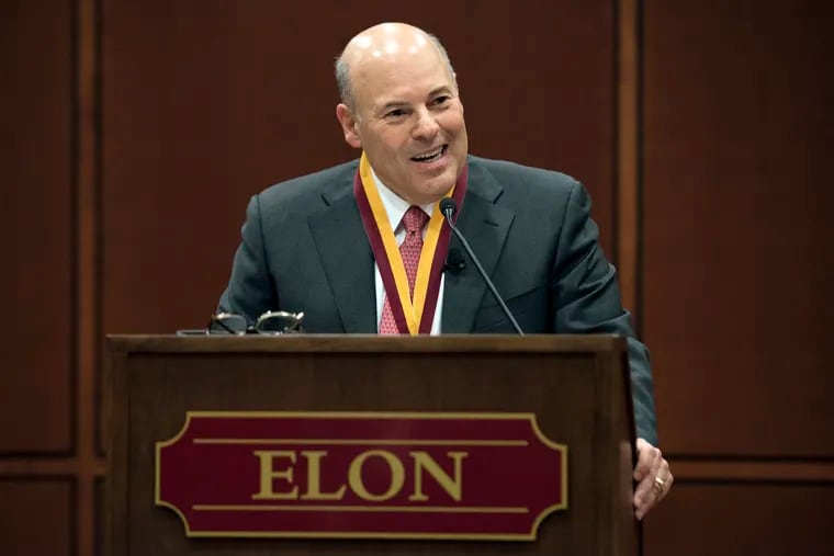 In this March 1, 2017, file photo, then Elon Trustee Louis DeJoy is honored with Elon's Medal for Entrepreneurial Leadership in Elon. N.C.