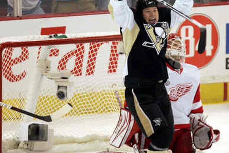 Pittsburgh's Ruslan Fedotenko celebrates the goal by Max Talbot that gave the Penguins a 1-0 lead against Detroit.
