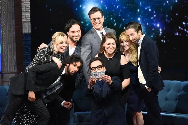 "Late Show" host Stephen Colbert (center) with the cast of CBS's "The Big Bang Theory": (clockwise, from bottom, Jim Parsons, Kunal Nayyar, Kaley Cuoco, Johnny Galecki, Mayim Bialik, Melissa Rauch, and Simon Hellberg, on Thursday, May 16.