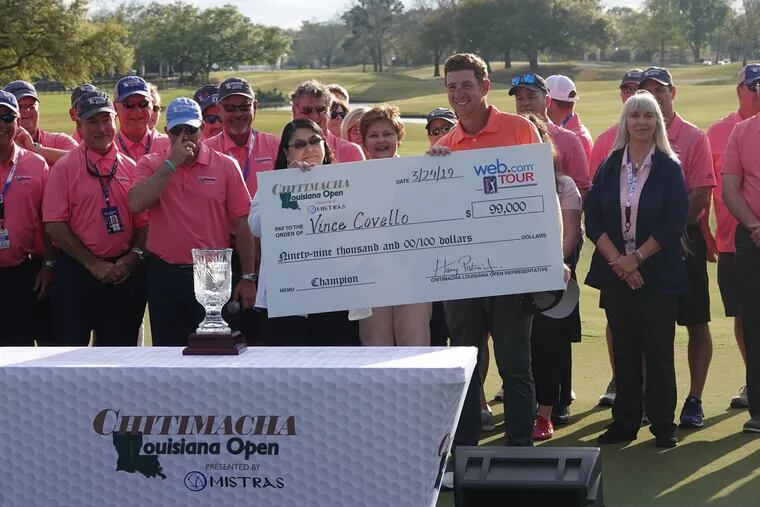Vince Covello is presented with the $99,000 first-prize check after winning the Chitimacha Louisiana Open on the Web.com Tour.