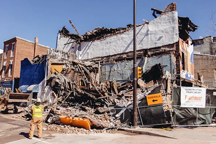 The Shirt Corner collapsed during demolition work in Philadelphia on March 13, 2014. (Dan King / For Philly.com)