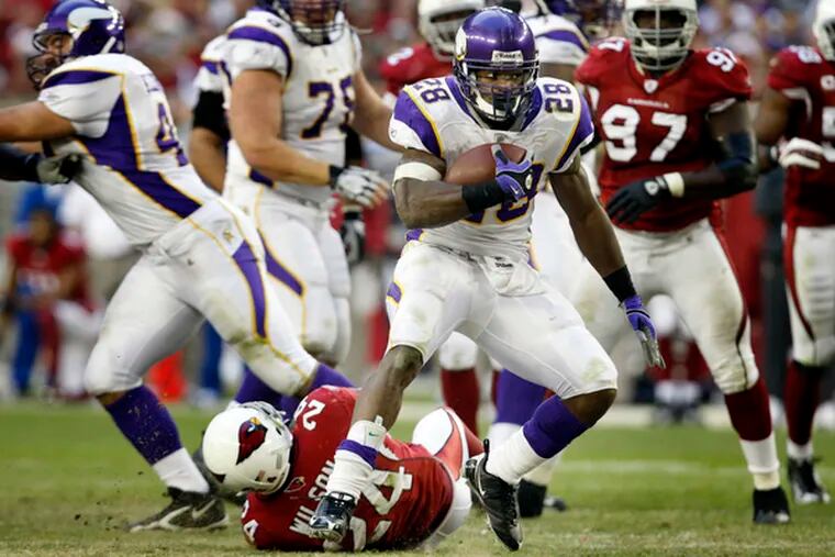 The Vikings&#0039; Adrian Peterson displays his offensive prowess against the Cardinals.
