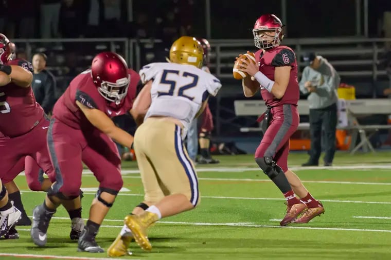 St. Joe's Prep quarterback Kyle McCord looks for an opening in the first half of the Hawks' win on Friday.