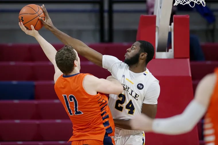 La Salle forward Jared Kimbrough (24) blocks a shot by Bucknell forward John Meeks (12) during the Explorers' 71-59 win at the Palestra this past Saturday.