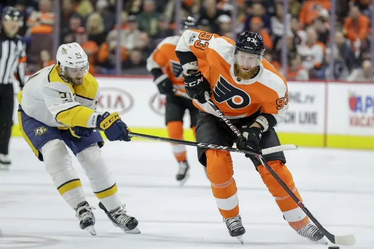 Flyers right wing Jakub Voracek skates with the puck past Nashville Predators left wing Austin Watson during the second period on Thursday.
