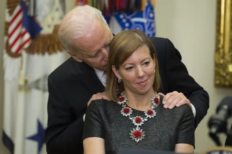 Stephanie Carter, the wife of former defense secretary Ash Carter, said this photo of then-Vice President Joe Biden whispering into her ear in 2015 was taken out of context.