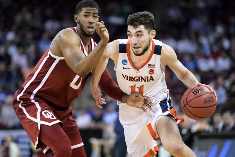 The Sixers would add a heady shooter if they selected Ty Jerome (right) in the NBA draft.