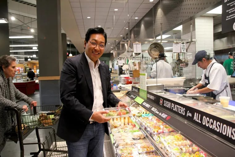 Josh Onishi, chief executive of Peace Dining, at the Genji sushi case at the Whole Foods Market on Pennsylvania Avenue.