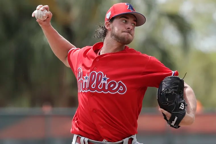 Aaron Nola pitches in the first inning of Sunday's Grapefruit League game against the Orioles.