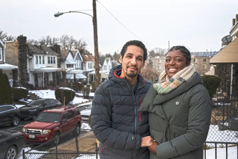 Latisha Thompson and her partner, Paul Prescod, near their Philadelphia home. The couple got help purchasing their first home through her union, AFGE.